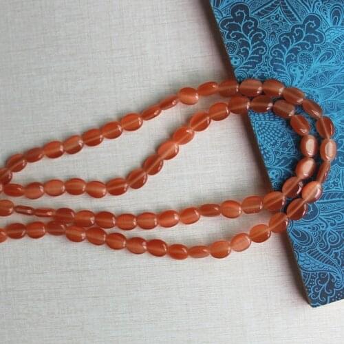 About 4x8x10mm oval cats eye glass beads,about 1.0mm in hole size,40 pieces per lot,wholesale price