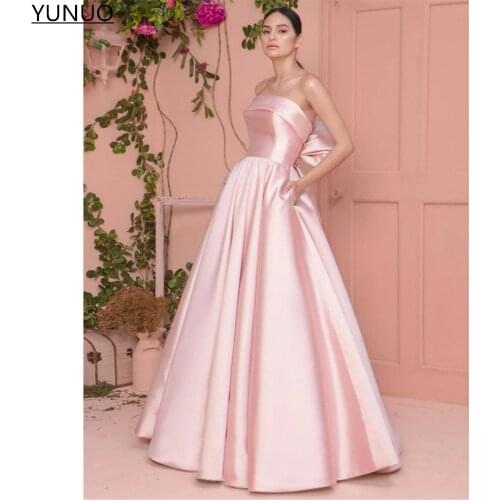 YUNUO Elegant Pink Satin Prom Bridesmaid Dresses 2021 Strapless Big Bow Back Formal Party Gowns Long Evening Dress with Pockets