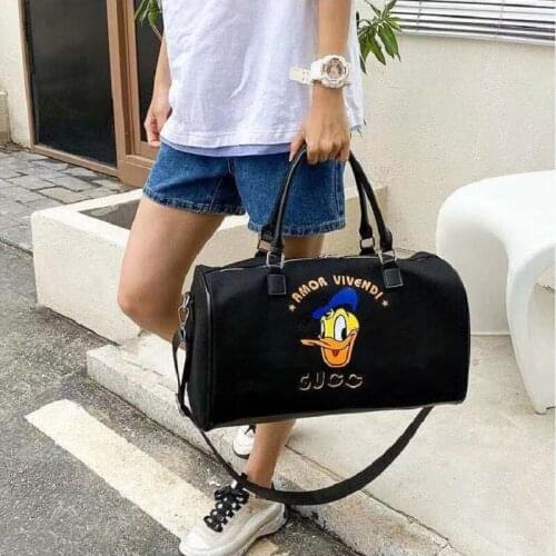 Disney Donald Duck outdoor hiking fitness canvas bag female new large-capacity tablet single shoulder messenger bag