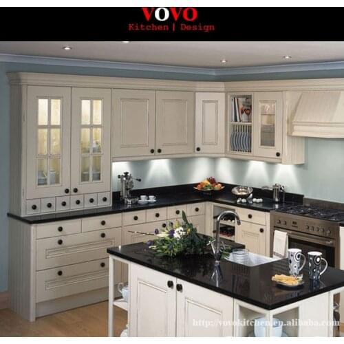 White wood kitchen cabinet with black quartz counter