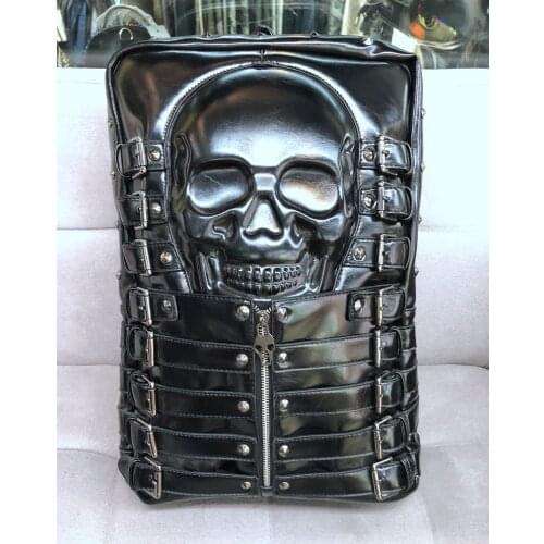 Fashion European and American casual men and women leather backpack personality skull head rivet bag travel bag computer bag tid