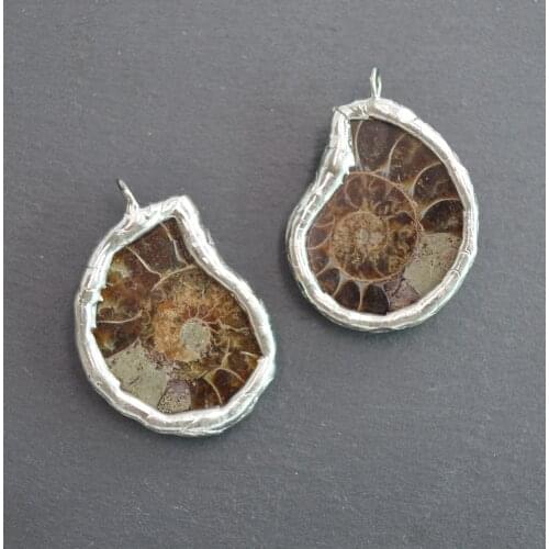 Rare Ammonite fossil pendant with silvery electroplated edges