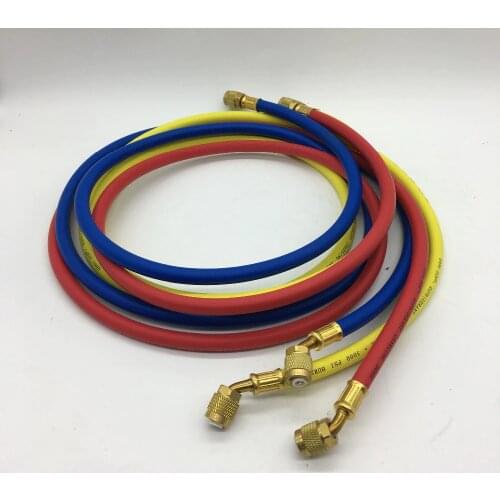 High pressure hose with 1/4" female SAE flare is working together with manifold to vaccuum and charge coolant in refrigeration