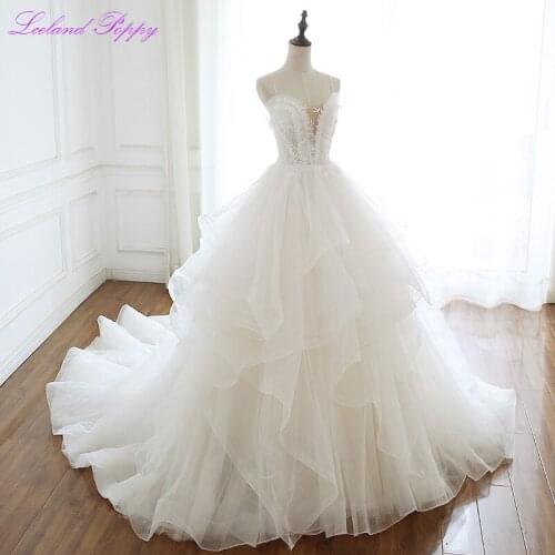 Glamorous A-line Spaghetti Straps Tulle Wedding Dresses Floor Length Sleeveless V-neck Tiered Beaded Bridal Gowns Chapel Train