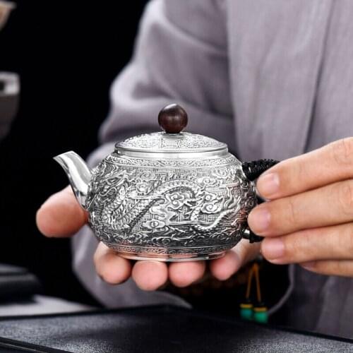 Dragon and Phoenix Chengxiang 999 sterling silver teapot, anti-scald heat insulation handle silver kettle, Kung Fu tea set