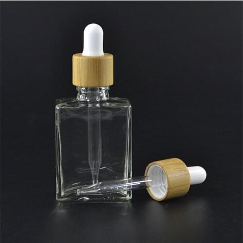 288pcs*Hot sale 30ml 1oz rectangular glass essential oil bottle blue light vape oil glass bottle with bamboo cap