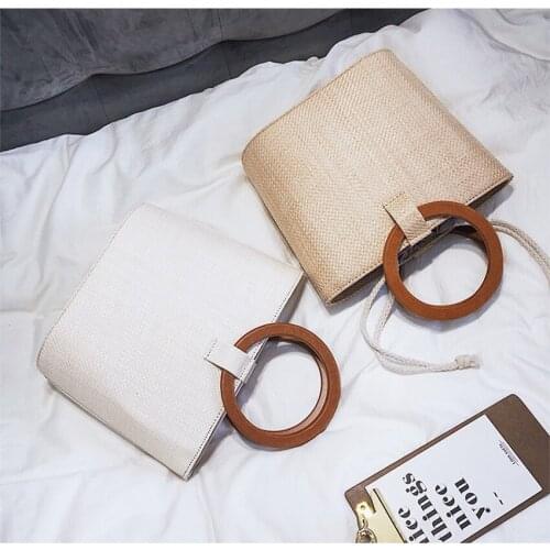 College wind summer new ring wooden handle woven handbag straw travel beach shoulder diagonal package