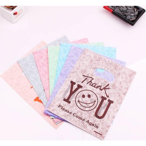 100pcs Jewelry Bags Plastic Shopping Bag with handle packaging gift bag Jewelry packing Bags Smile Thank You Style 15x20cm