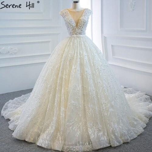 Dubai High Quality Ivory Sexy Wedding Dresses 2020 Sleeveless Pearls Princess Bridal Gowns HM66904 Custom Made
