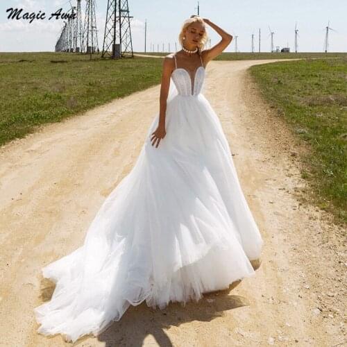 Magic Awn 2022 Boho Wedding Dresses Spaghetti Straps Beaded Shiny White Tulle Illusion Boho Mariage Gowns With Wrap Vestidos