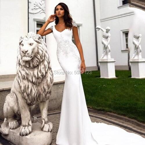 2020 Satin Mermaid Wedding Dresses Cap Sleeves V Neck Open Back Bridal Wedding Gown Vestido De Noiva Lace Appliques Court Train