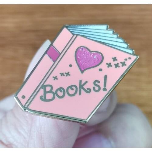 Magical Pink Books Lapel Pin Pink is a magical pony who lives in Dreamland, a land of sunshine, rainbows,and happy animals