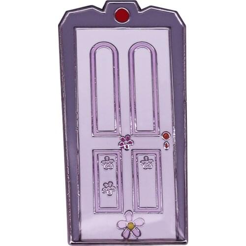 A new Monsters Inc. enamel pin badge features Boos door from the movie when opened, Sulley and Mike Wazowski appear