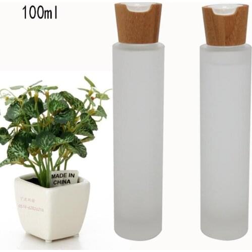 Free shipping 100ml 10pcs/lot frosted glass pure dew/elite fluid cosmetics bottles with bamboo press cover