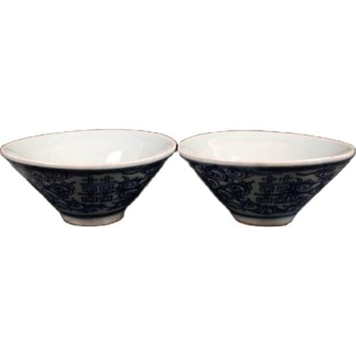 A pair of blue and white double-happiness cups with lotus pattern in Jingdezhen, China