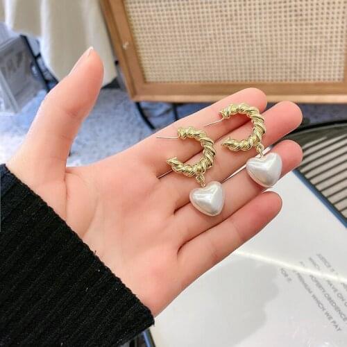 Fashion temperament love French pearl earrings female metal new grain texture elegant tide restoring ancient ways stud earrings