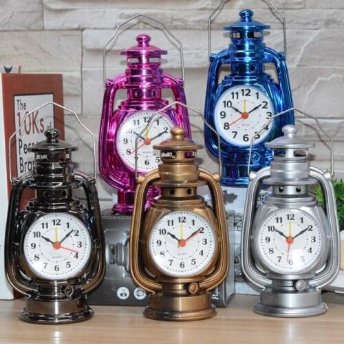 A Creative gift clock retro setting desk alarm clock home bedroom bedside table for a boy with kerosene lamp