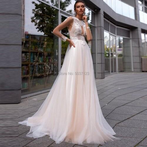 Champagne Long Sleeves Wedding Dresses A Line O Neck Button Illusion Lace Appliques Vestido De Noiva Court Train Bridal Gowns