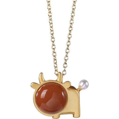 S925 sterling silver gold plated Southern red agate Pearl Calf Pendant Womens Chinese zodiac cow Temperament Pendant
