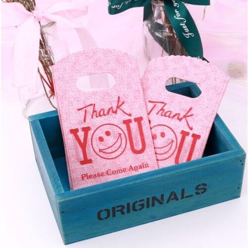100 pcs More Pattern Jewelry Plastic Bag With Handles 9*15cm Wedding Gift Boutique Gift Shopping Packaging Plastic Handle Bag