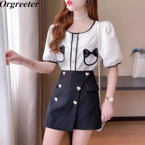 2021 Summer New O-neck Puff sleeve Pearl Single-breasted Blouse Tops and Heart shape Beaded Button Irregular Skirt 2 Piece Sets
