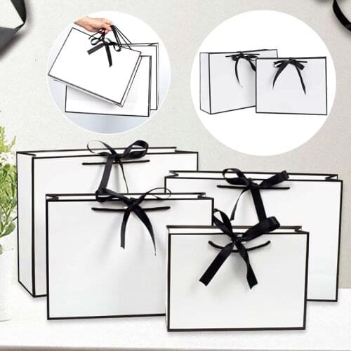 Modern Simple Black Frame White Cardboard Gift Bag Foldable Hand-Held Clothes Gift Packaging Bag Bow Gift Packaging Bag