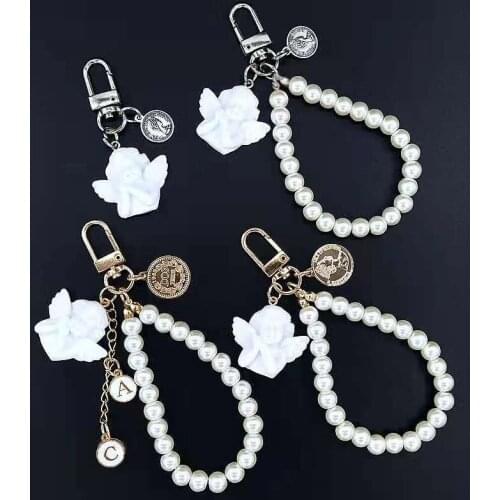 Classic Retro Keychain Angel Sculpture Pearl Keychain Backpack Earphone Box Pendant Ins Metal Jewelry Creative Travel Souvenirss