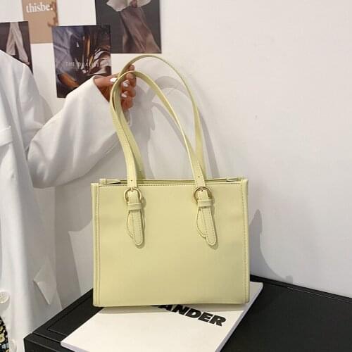 The new one-shoulder atmospheric ladies bag 2021 fashion simple commuter shoulder bag belt decoration solid color messenger bag