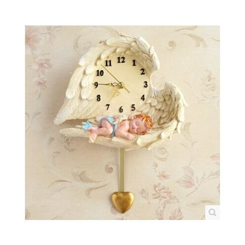 Hot explosions high-end European court resin room living room creative wall clock cute angel tire wall clock