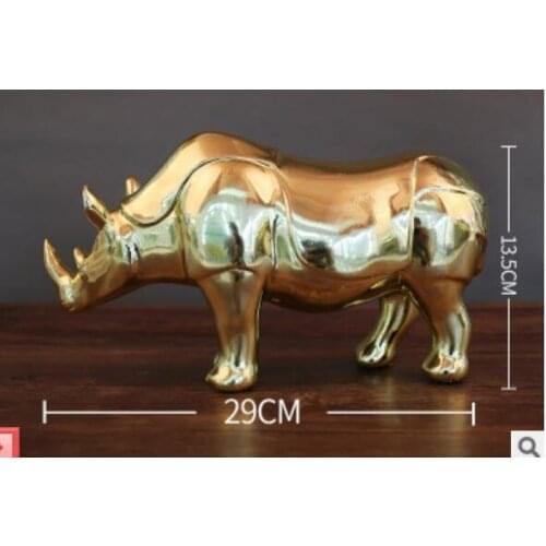 Aureate rhinoceros puts on electroplating handicraft decorate creative sitting room to act role of article office desktop