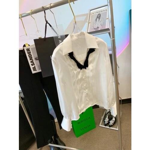 2021 summer new designer womens shirt has the luster of silk satin. It looks good with summer T-shirt and suspender skirt