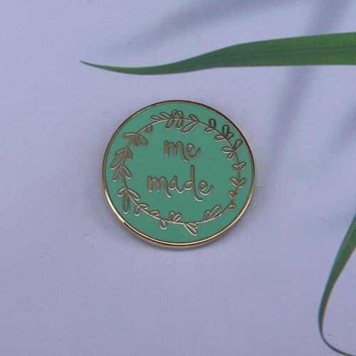 Show off your me-made outfits in style with this super shiny mint enamel pin by Pink Coat Club