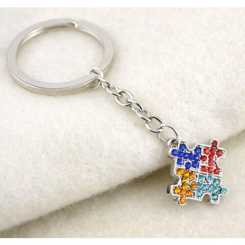 Rhodium plated zinc studded with sparkling crystals Autism Awareness Puzzle Piece charm key chain