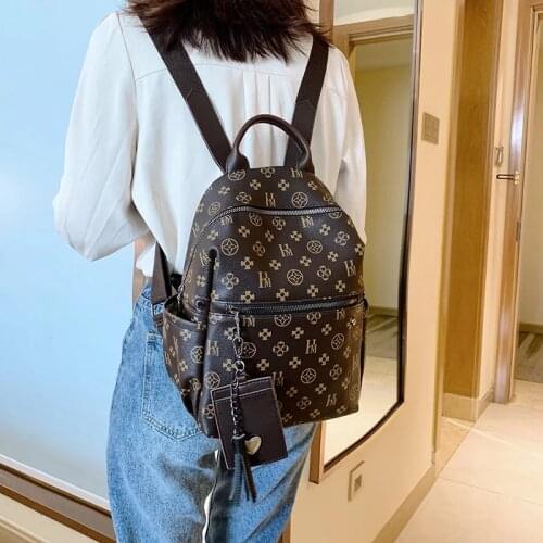 Classic PU leather womens backpack, luxury designer bag, European and American style, retro, leisure
