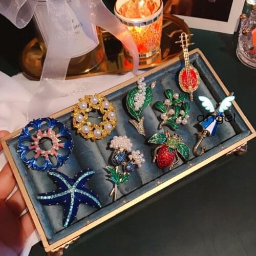 Japan and South Korea Europe and enamel glaze brooch leaves the waves of the sea pearl umbrella guitar female plants