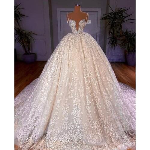 2021 Luxury Arabic Wedding Dresses Spaghetti Straps Bridal Gowns Beading Pearls Sweep Train Vintage Lace Appliqued vestido