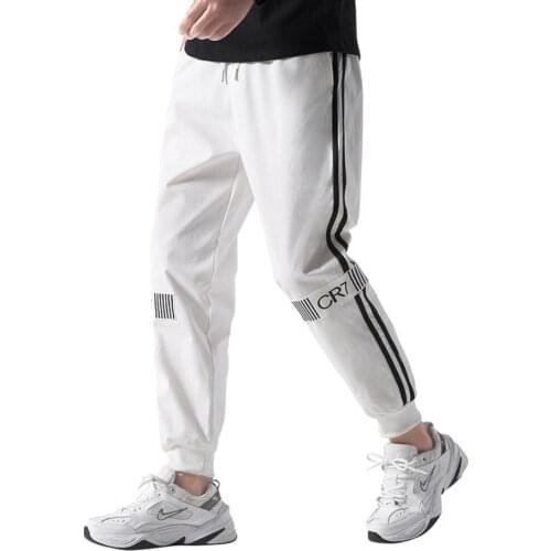 Spring and autumn thin casual sports pants mens solid color trousers mens nine-point loose two-bar letter beamed sports pants