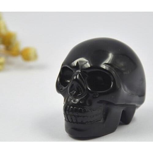 Natural crystal obsidian skull head