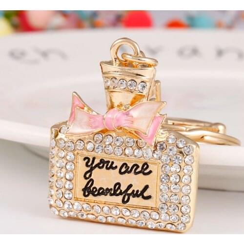 Bow tie perfume bottle alloy key chain rhinestone car key chain boys and girls small gift bag pendant