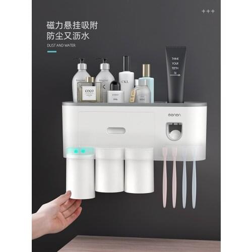 Magnetic adsorption inverted toothbrush holder with dual automatic toothpaste squeezer dispenser storage rack Toothbrush holder
