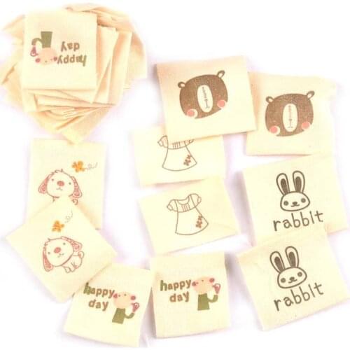 50pcs Beige Clothing Tags Cartoon Print Cotton Woven Labels For Garment Bags DIY Sewing Accessories Shoes Bags Tags c2181