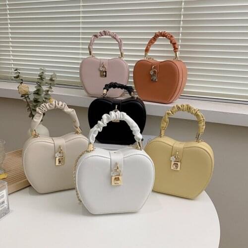 Latest solid color pu leather folded handle round shape ladies shoulder women crossbody bags 2021 with chain