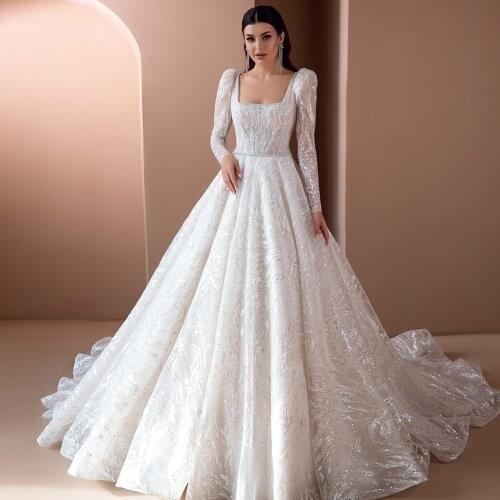 Luxury Wedding Dresses 2021 Beated Belt Long Sleeve Lace Up Back Shiny Sweep Train A-Line Boat Neck Bridal Gowns Vestidos