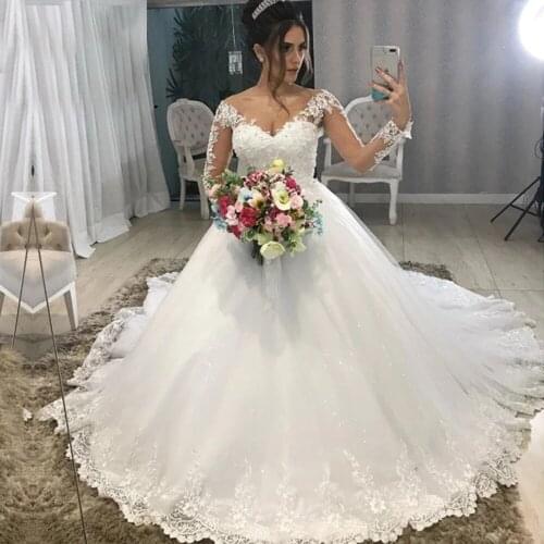 Modest Design Sheer Jewel Neck Long Sleeves Wedding Dresses Vetidos De Novia Princess Lace Appliques Beaded Ball Gown Bridal
