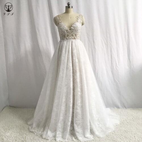 Sexy Vestidos De Novias Plunging V Neck Appliqued Lace Beaded Sleeveless A Line Lace Wedding Dresses