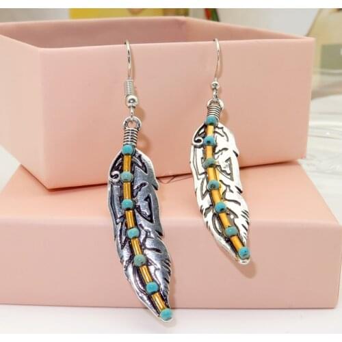 Rongyu palace retro style Turquoise Feather Earrings 2020 new electroplated ancient silver color separation Earrings