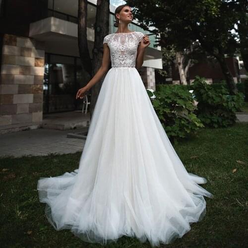 Sexy Lace A-Line Wedding Dresses O Neck Cap Shoulder Button Cut-Out Appliqued 2021 New Floor Length Bridal Gowns