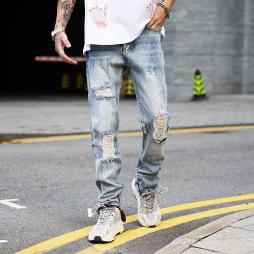 Bieber Mens Clothing Fashion Hole Knee Irregular Cutting to Destroy the Broken Jeans Pants Stage Singer Costumes