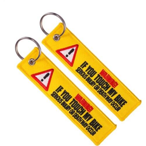 Popular ornaments embroidered key chain decorated with yellow embroidered words warning danger warning label key chain backpack
