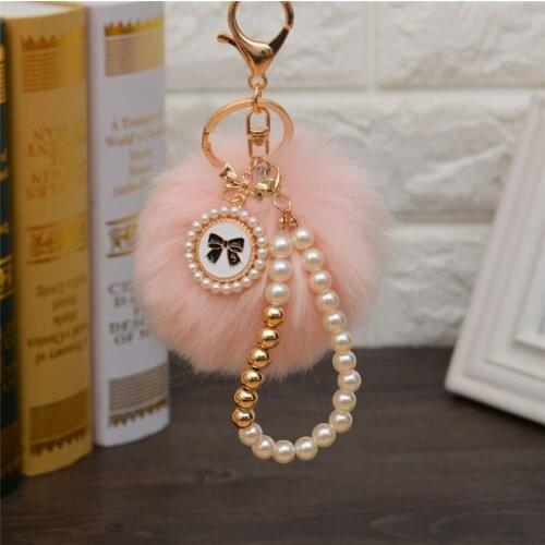 2021 Fashion Pearl Chain Crystal Bottle Bow Pompom Keychain Car Women handBag Key Chain Ring Fluffy Puff Ball Keychains Jewelry